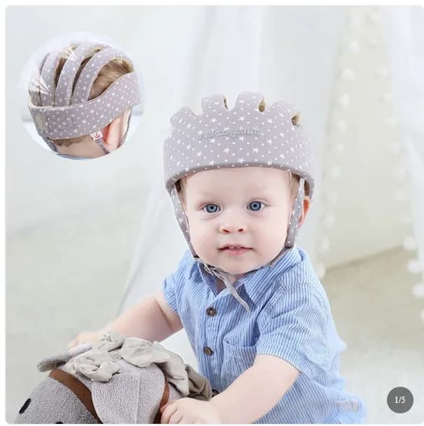Baby wearing a soft safety head protector